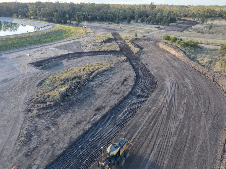 Aerial view of a JHG Civil grader trimming new site roads